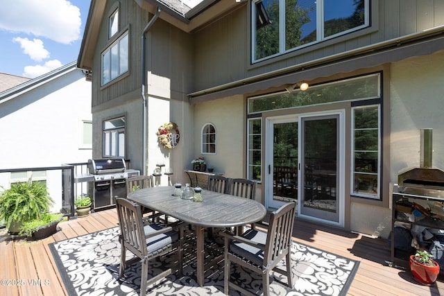 4240 Spruce Way, Vail, CO 81657 - wooden terrace with area for grilling and outdoor dining space