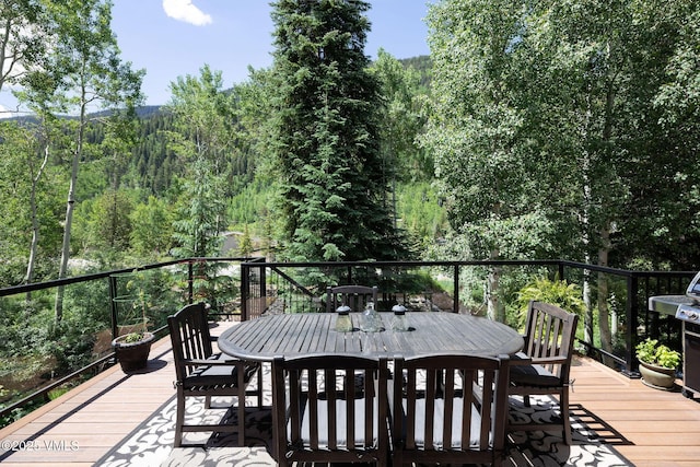 4240 Spruce Way, Vail, CO 81657 - deck with outdoor dining area and a forest view