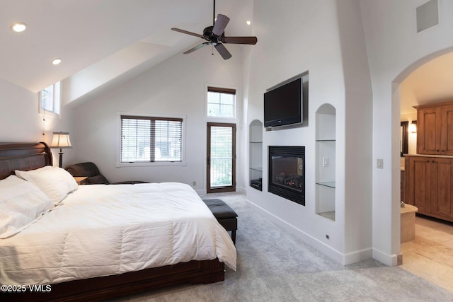 4240 Spruce Way, Vail, CO 81657 - bedroom featuring high vaulted ceiling, arched walkways, light colored carpet, recessed lighting, and a glass covered fireplace