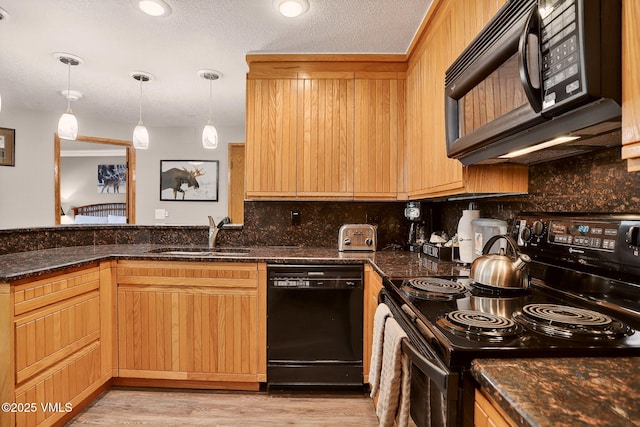 120 Offerson Unit 5160, Beaver Creek, CO 81620 - kitchen featuring black appliances, decorative backsplash, dark stone counters, light wood-type flooring, and pendant lighting