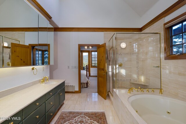 bathroom featuring lofted ceiling, plus walk in shower, vanity, and a wealth of natural light