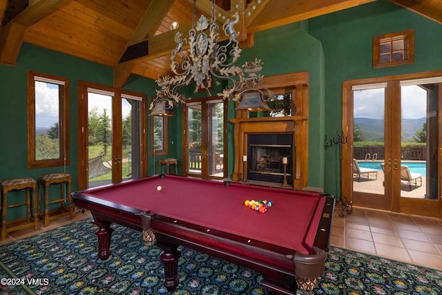 rec room with lofted ceiling with beams, tile patterned flooring, wooden ceiling, and french doors