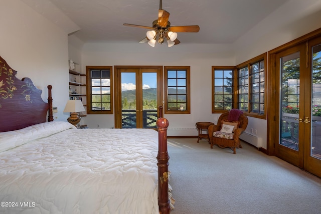 bedroom with multiple windows, access to exterior, baseboard heating, light carpet, and french doors