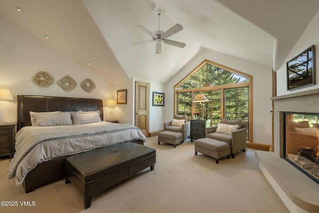 416 Forest Rd Unit A, Vail, CO 81657 - bedroom with vaulted ceiling, a lit fireplace, carpet flooring, and ceiling fan