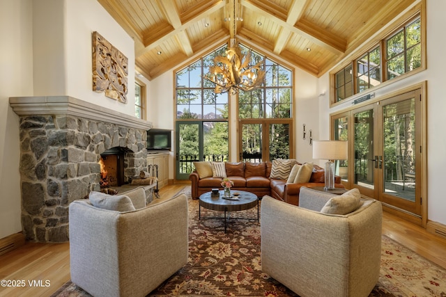 416 Forest Rd Unit A, Vail, CO 81657 - living room with a wood ceiling with exposed beams, wood finished floors, high vaulted ceiling, a chandelier, and french doors