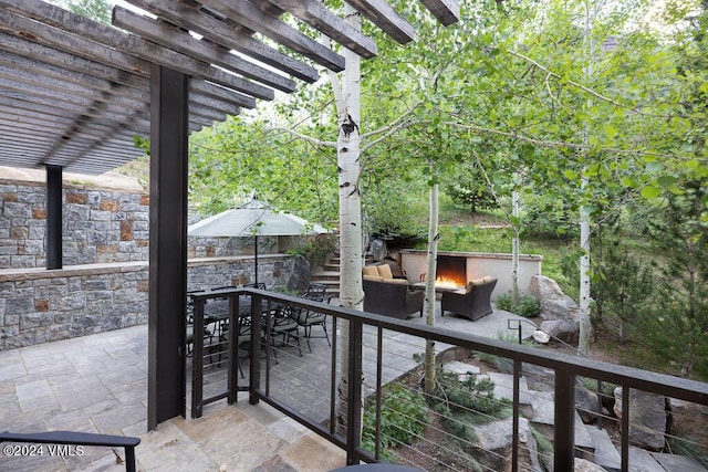 view of patio / terrace featuring an outdoor hangout area and a pergola