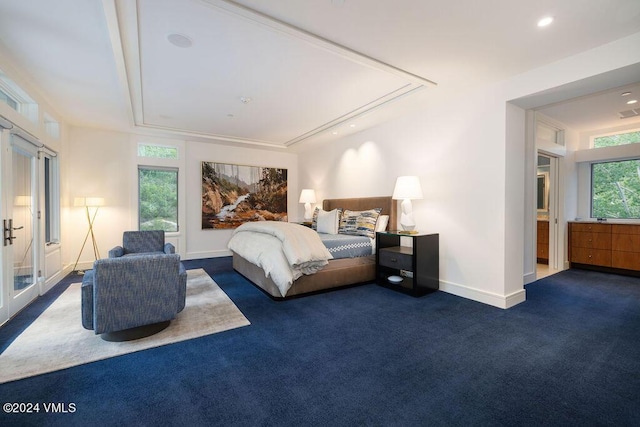 bedroom with dark colored carpet and french doors