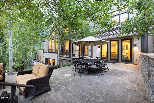 view of patio / terrace featuring a pergola and outdoor lounge area