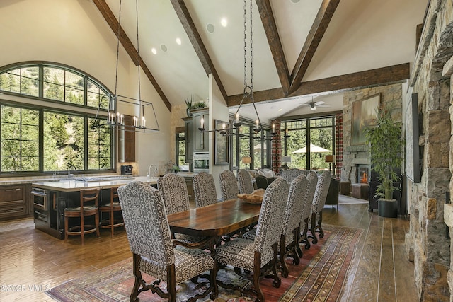 179 S Fairway Dr, Beaver Creek, CO 81620 - dining area featuring high vaulted ceiling, dark wood-style flooring, beamed ceiling, a chandelier, and a ceiling fan