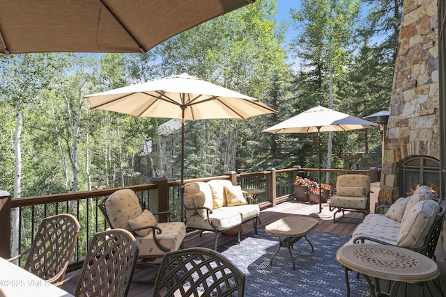 179 S Fairway Dr, Beaver Creek, CO 81620 - deck featuring an outdoor hangout area and view of wooded area