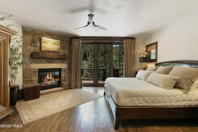 179 S Fairway Dr, Beaver Creek, CO 81620 - bedroom featuring access to outside, a fireplace, hardwood / wood-style floors, and ceiling fan