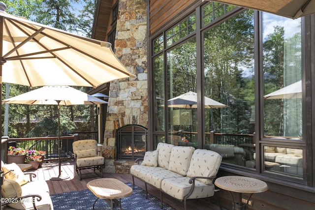 179 S Fairway Dr, Beaver Creek, CO 81620 - sunroom / solarium featuring healthy amount of natural light and an outdoor living space with a fireplace