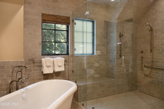 179 S Fairway Dr, Beaver Creek, CO 81620 - full bathroom with a shower stall, a freestanding bath, and tile walls