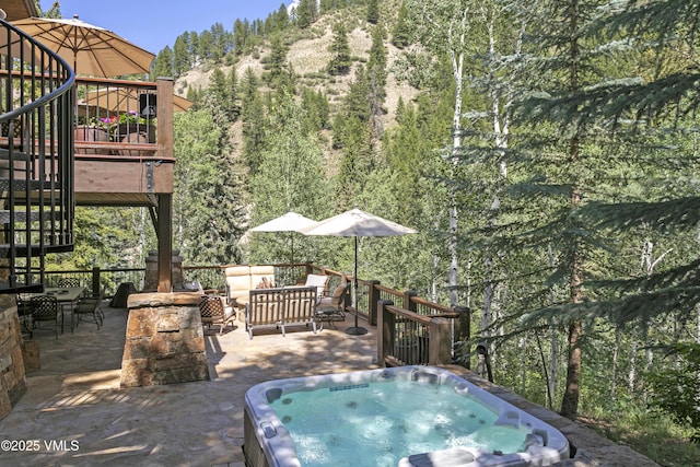 179 S Fairway Dr, Beaver Creek, CO 81620 - view of patio / terrace with an outdoor hot tub, outdoor lounge area, a wooded view, and stairway