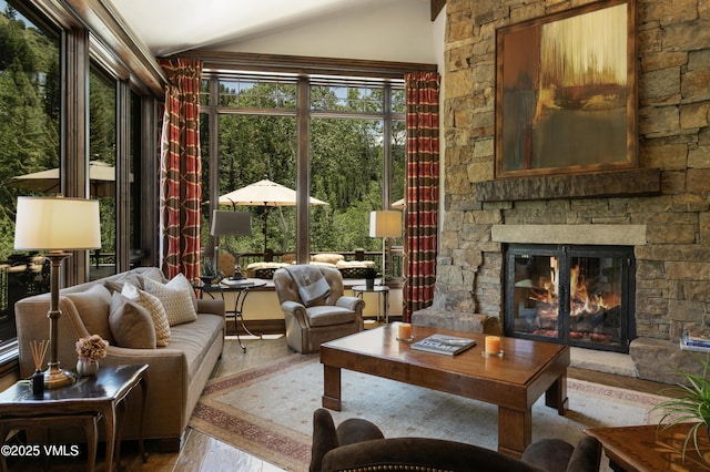 179 S Fairway Dr, Beaver Creek, CO 81620 - living area with wood finished floors, lofted ceiling, and a fireplace