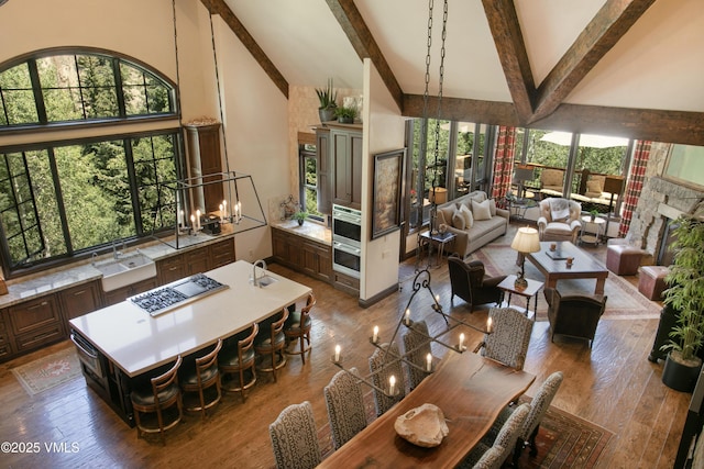 179 S Fairway Dr, Beaver Creek, CO 81620 - dining area featuring high vaulted ceiling, beam ceiling, and wood finished floors