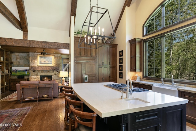 179 S Fairway Dr, Beaver Creek, CO 81620 - kitchen featuring paneled fridge, beam ceiling, high vaulted ceiling, dark wood-style flooring, and a chandelier
