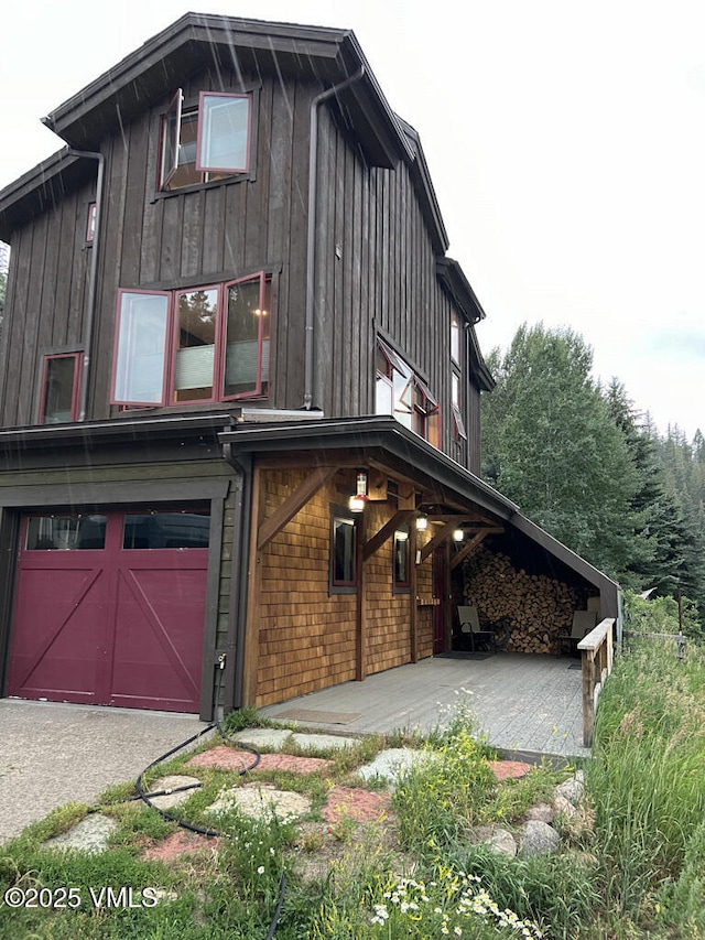3105 Bellflower Dr, Vail, CO 81657 - view of side of home featuring a garage and board and batten siding