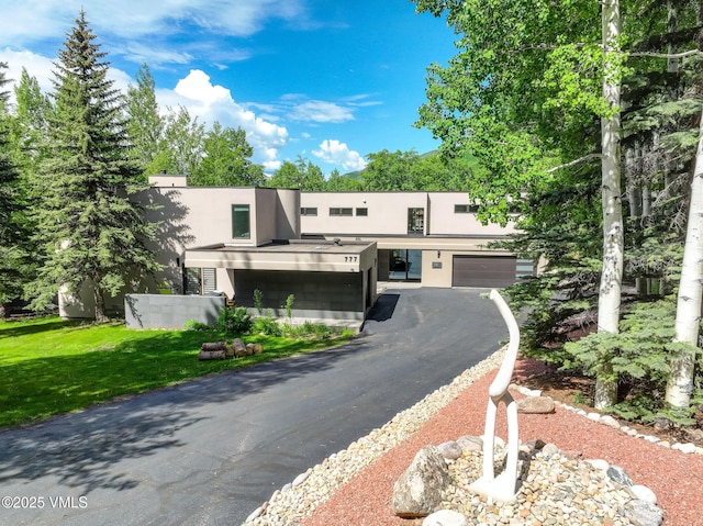 777 Potato Patch Dr Unit A, Vail, CO 81657 - view of front of property with stucco siding and driveway