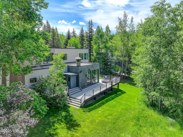 777 Potato Patch Dr Unit A, Vail, CO 81657 - back of house featuring stucco siding and a yard