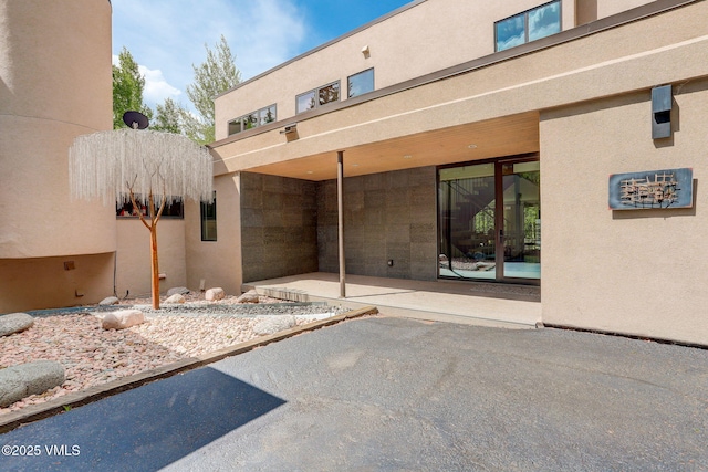 777 Potato Patch Dr Unit A, Vail, CO 81657 - doorway to property with a patio area and stucco siding