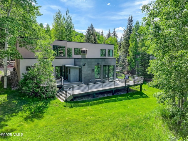 777 Potato Patch Dr Unit A, Vail, CO 81657 - rear view of property featuring a lawn, a wooden deck, and stucco siding