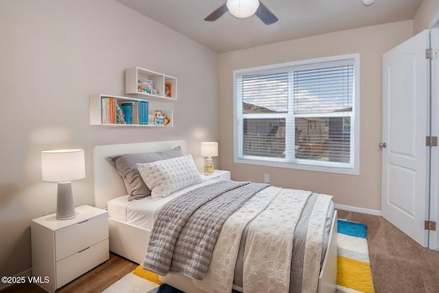 bedroom featuring baseboards and ceiling fan