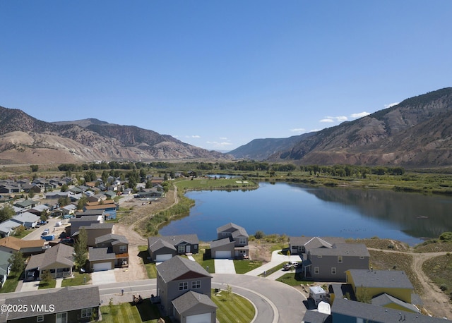 aerial view with a residential view and a water and mountain view