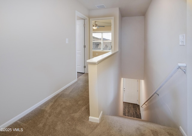 stairs featuring baseboards, carpet flooring, and visible vents