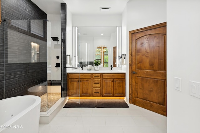 295 Main St Unit R305, Edwards, CO 81632 - bathroom featuring a stall shower, double vanity, a soaking tub, and tile patterned flooring