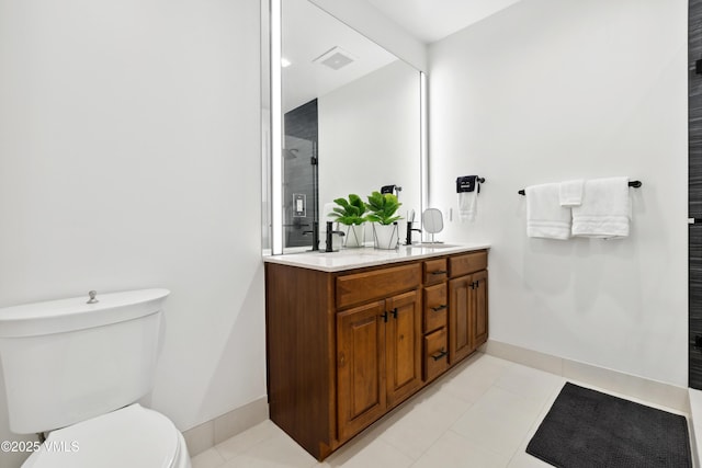 295 Main St Unit R305, Edwards, CO 81632 - bathroom with toilet, double vanity, baseboards, and a shower with door