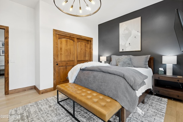 295 Main St Unit R305, Edwards, CO 81632 - bedroom with light wood finished floors and baseboards