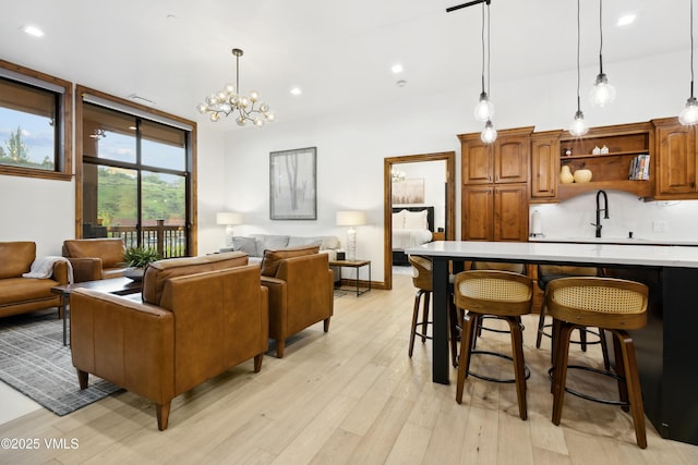 295 Main St Unit R305, Edwards, CO 81632 - living room with light wood-style floors, a chandelier, and recessed lighting