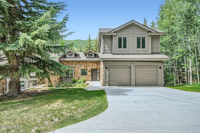 1359 Greenhill Ct Unit E, Vail, CO 81657 - view of front of home featuring an attached garage, driveway, a front yard, stone siding, and a shingled roof