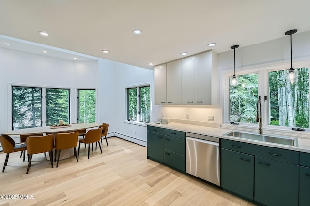 1359 Greenhill Ct Unit E, Vail, CO 81657 - kitchen with stainless steel dishwasher, green cabinets, light countertops, light wood-style flooring, and recessed lighting