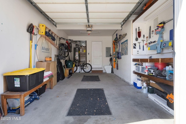 garage featuring electric panel, gas water heater, a workshop area, and a garage door opener