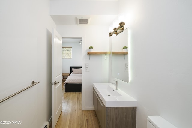 511 Metcalf Unit J30, Avon, CO 81620 - half bath with vanity, toilet, and wood finished floors
