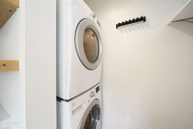 511 Metcalf Unit J30, Avon, CO 81620 - washroom with stacked washing machine and dryer