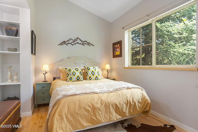 12 June Creek Rd, Edwards, CO 81632 - bedroom featuring hardwood / wood-style flooring, lofted ceiling, and baseboards
