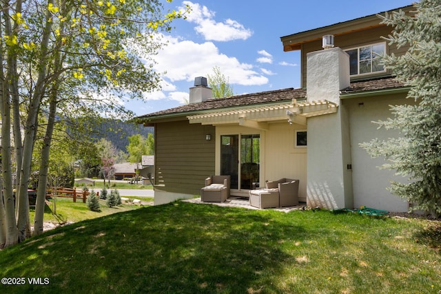 12 June Creek Rd, Edwards, CO 81632 - back of house featuring a chimney and a lawn