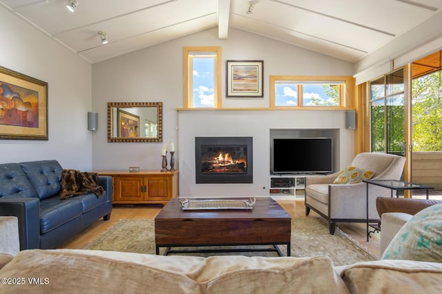 12 June Creek Rd, Edwards, CO 81632 - living room with wood finished floors, plenty of natural light, and a glass covered fireplace