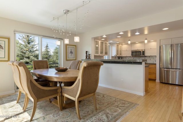 12 June Creek Rd, Edwards, CO 81632 - dining area featuring light wood-type flooring, recessed lighting, and baseboards