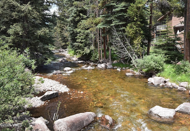 4479 Timber Falls Ct Unit 2001, Vail, CO 81657 - view of yard with a wooded view