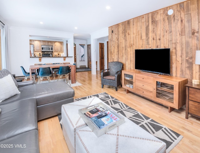 4479 Timber Falls Ct Unit 2001, Vail, CO 81657 - living area featuring light wood finished floors, wooden walls, and recessed lighting