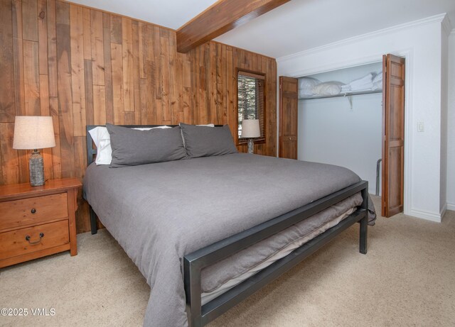 4479 Timber Falls Ct Unit 2001, Vail, CO 81657 - bedroom with wood walls, beamed ceiling, carpet, and a closet