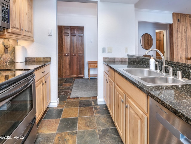 4479 Timber Falls Ct Unit 2001, Vail, CO 81657 - kitchen featuring stainless steel appliances, stone tile floors, dark countertops, backsplash, and crown molding