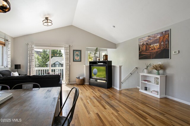 443 Porphyry Rd Unit F, Gypsum, CO 81637 - dining space featuring wood finished floors, lofted ceiling, and baseboards