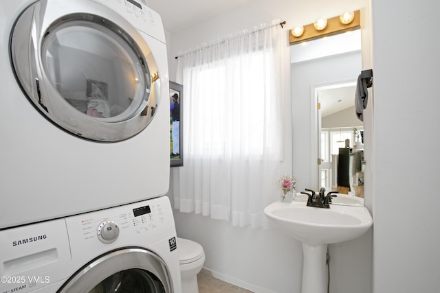 443 Porphyry Rd Unit F, Gypsum, CO 81637 - half bath featuring estacked washer and dryer and toilet