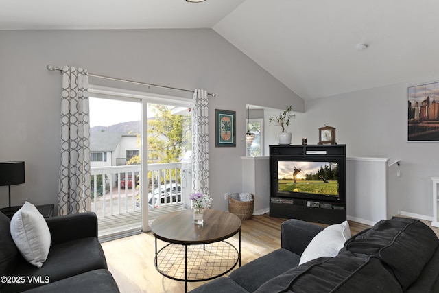 443 Porphyry Rd Unit F, Gypsum, CO 81637 - living area with vaulted ceiling and wood finished floors