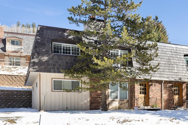 4093 Spruce Way # 30, Vail, CO 81657 - view of front of house with brick siding and mansard roof